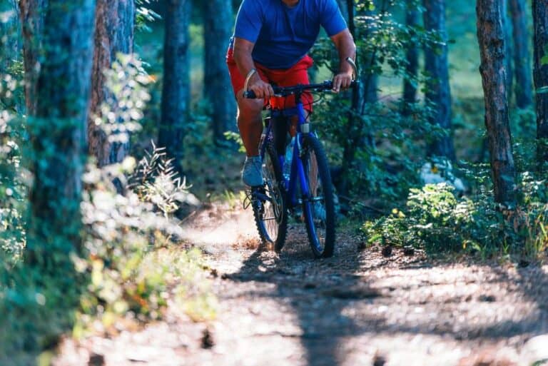 Overweight man rides a mountain bike